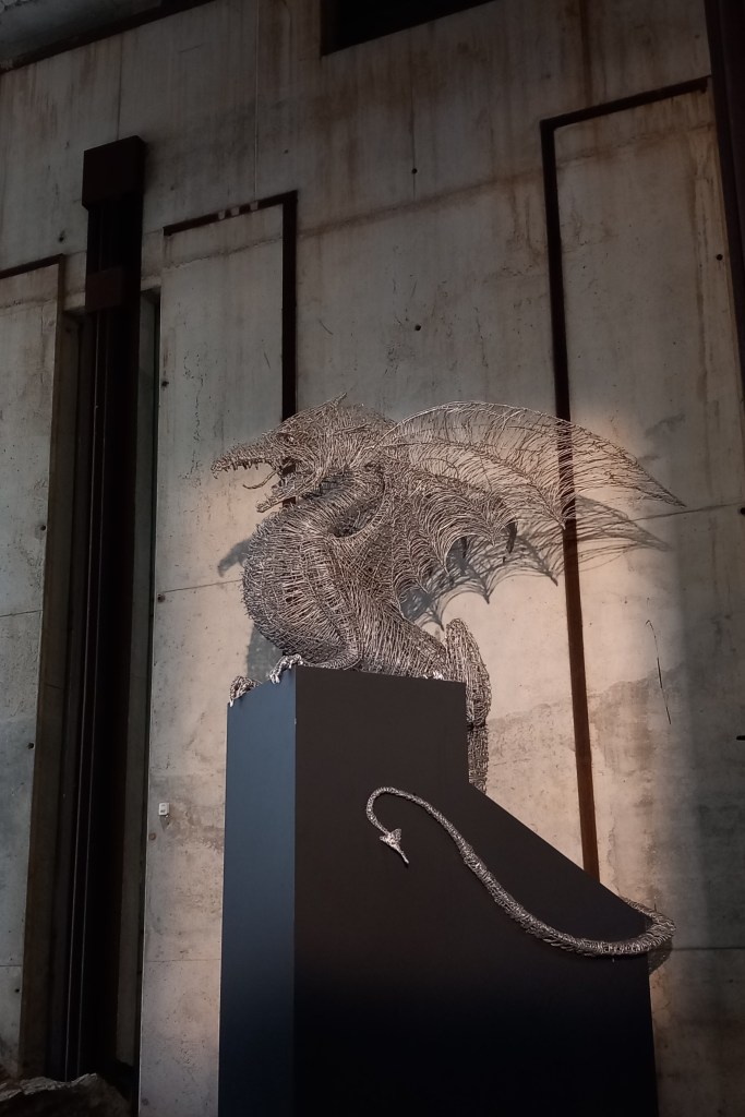 A statue of a dragon, made of wire, at the entrance of the Ljubljana castle.
