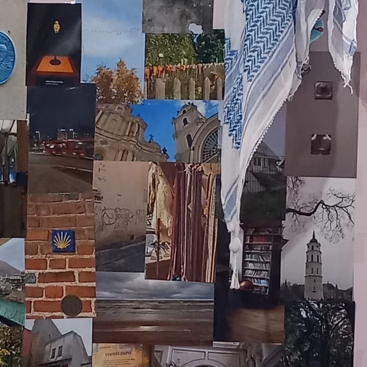 A collage of various photographs and images arranged on a wall, featuring urban scenes, nature, architecture, and decorative elements, with a piece of fabric draped over the side.